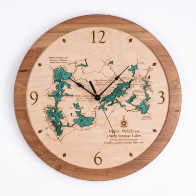 This is a clock featuring upper and lower Saranac Lakes in the Adirondacks of New York